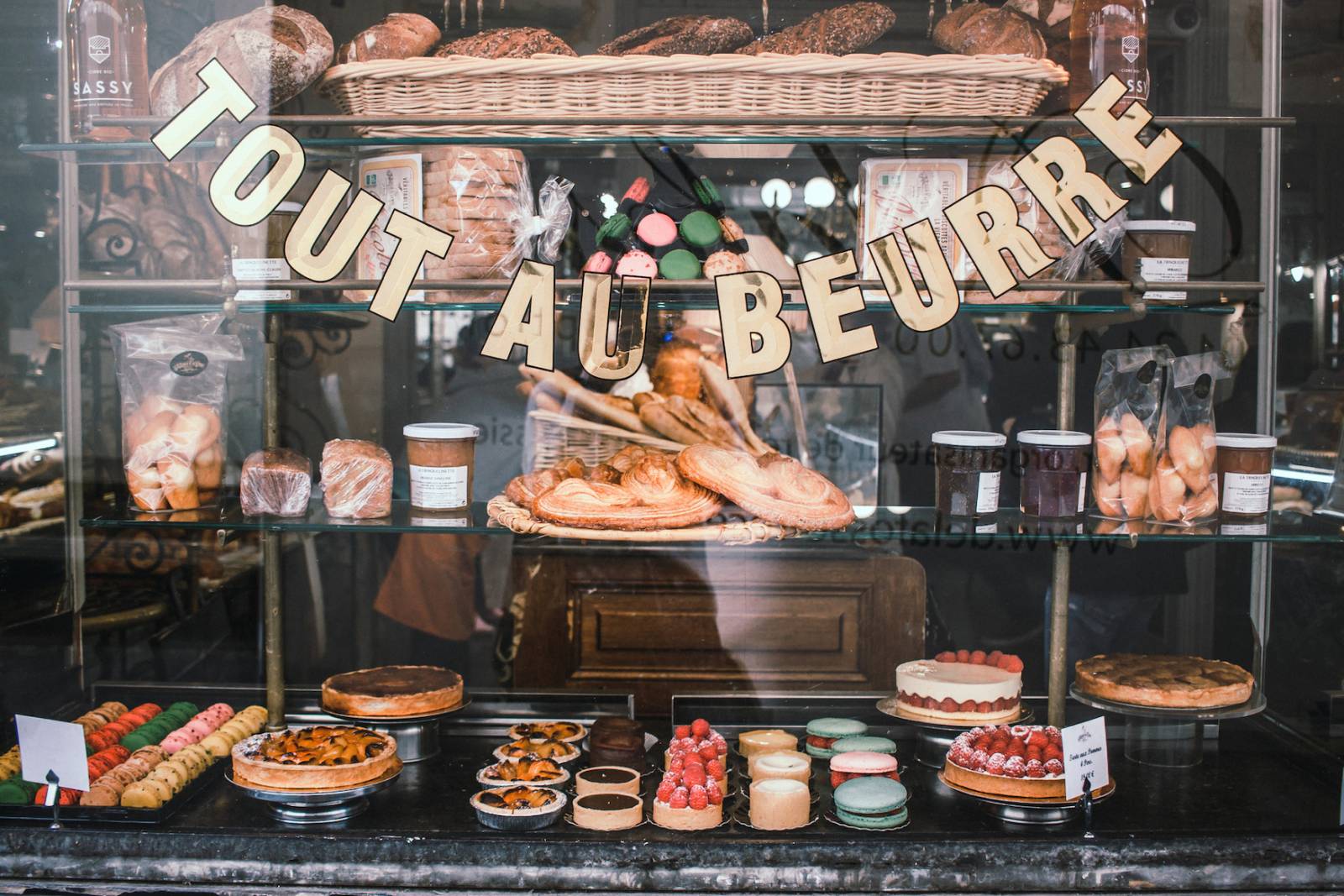 Window of a french bakery stop during the Paris Sweet & Savory Private Food Tour