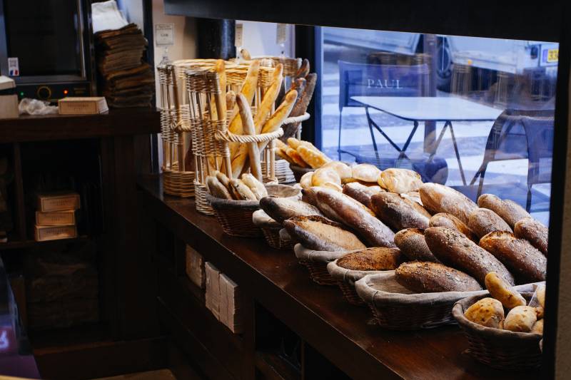 Parisian Bakery with bread exposed, private sweet & savory food tour in Paris by Deluxe France