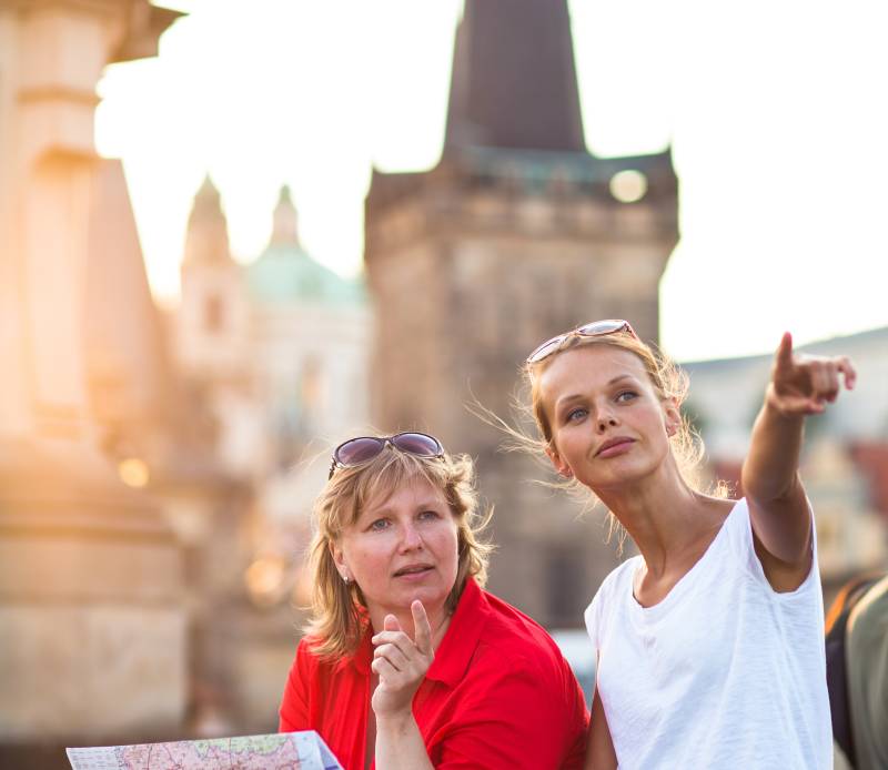 Guide with tourist in Paris during a private guided walking Tour  by Deluxe France