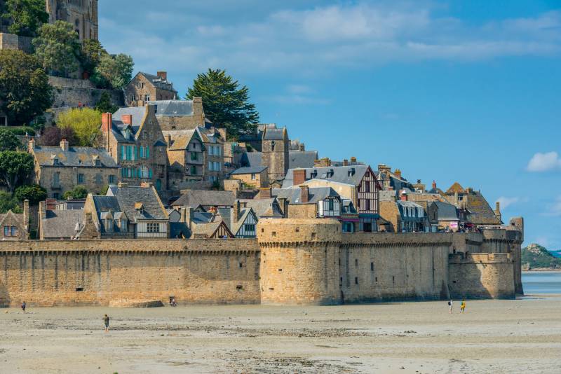 low tide in Mont Saint Michel, big wall surrounding the Abbey
