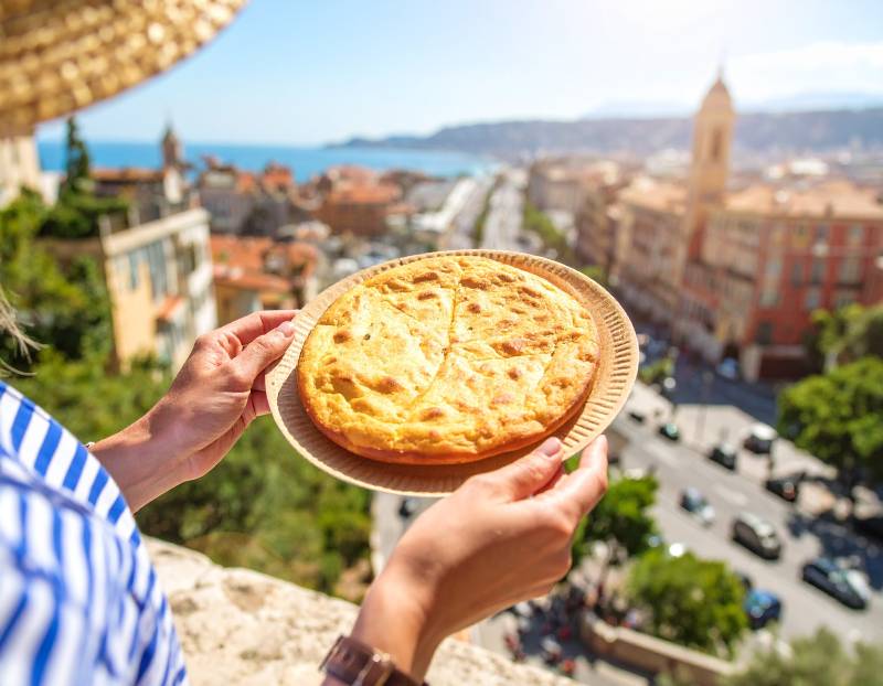 Socca traditional food in Nice during a walking Food Tour in the French Riviera